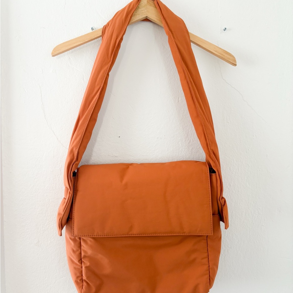Vibrant Orange Crossbody Bag with Flap Closure